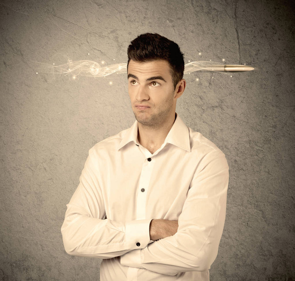 Fast creative sales guy with smoking bullet - Foto, afbeelding
