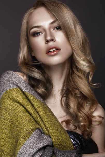 Beautiful woman with healthy skin and hair curls, posing in studio. Beauty face. - Valokuva, kuva
