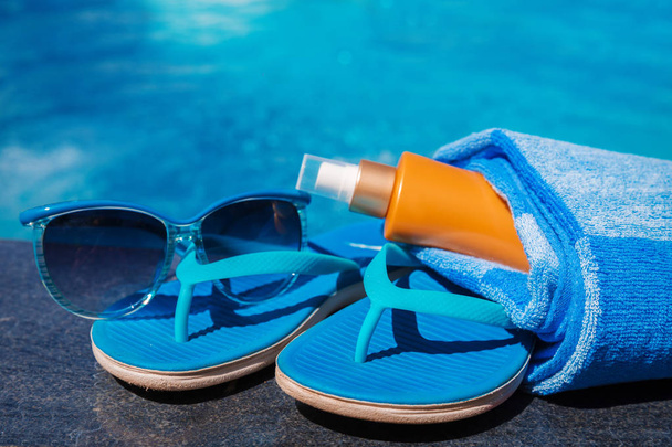 Sunglasses sunscreen cream,slippers and towel - Fotó, kép
