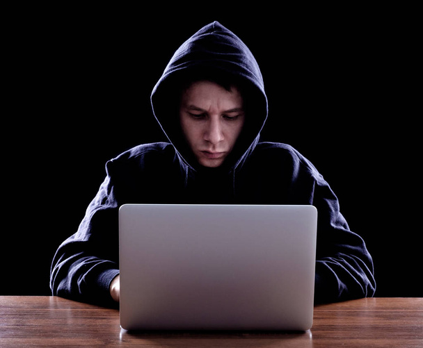Computer hacker stealing data from laptop - Fotografie, Obrázek