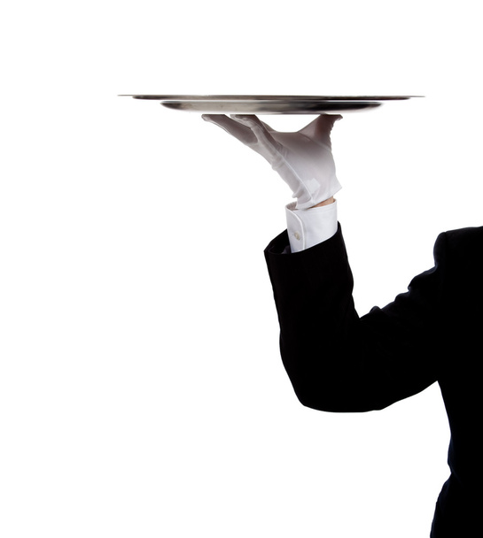 A butler's gloved hand holding a silver tray - Zdjęcie, obraz
