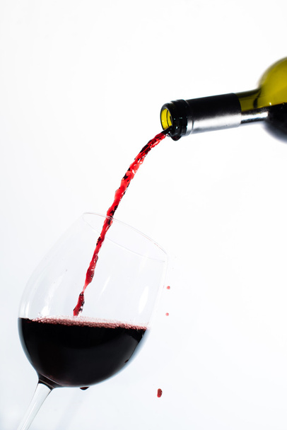 Red wine pouring into a glass - Fotografie, Obrázek