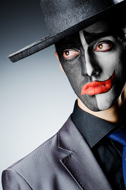 Businessman with clown face paint - Φωτογραφία, εικόνα