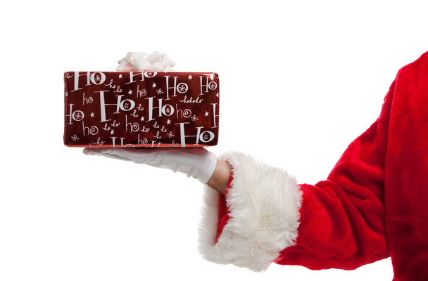 Santa κρατώντας ένα χριστουγεννιάτικο δώρο - Φωτογραφία, εικόνα