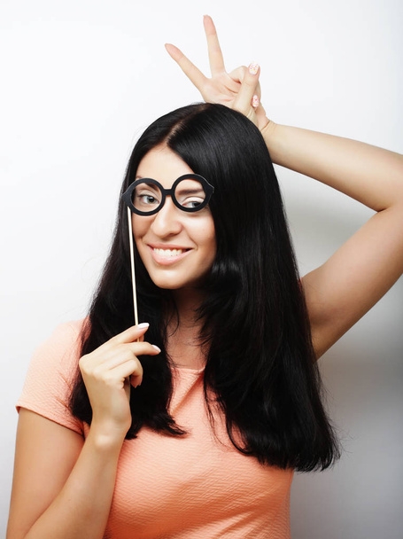 Attractive playful young woman with false glasses - Photo, Image
