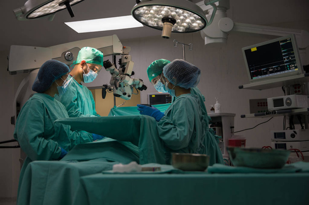 Group of doctors in operating room - Fotó, kép