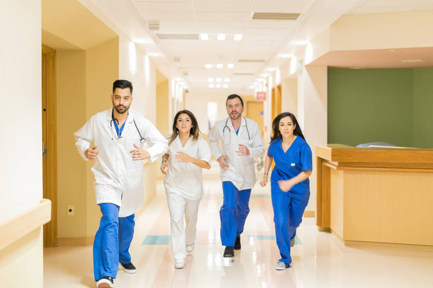 Doctors running through hallway - Photo, Image