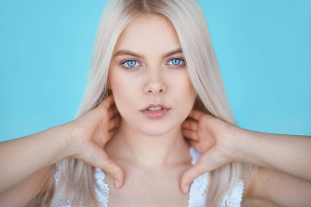 beauty teenage girl on blue color background - Photo, Image