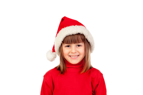 funny little girl in christmas hat - Foto, afbeelding