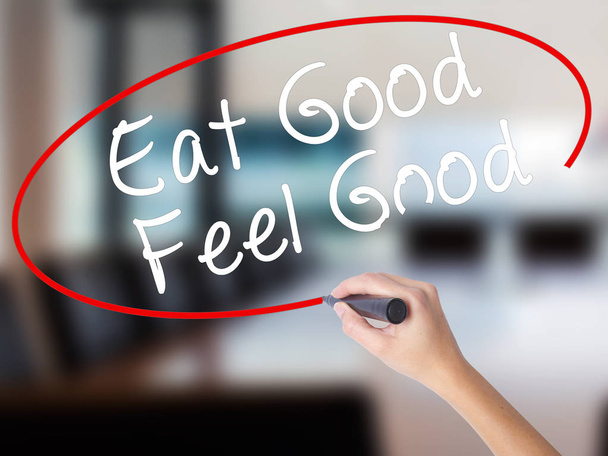 Woman Hand Writing Eat Good Feel Good with a marker over transpa - Photo, Image