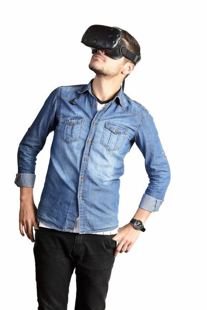 Young man using 360 degrees Virtual Reality glasses - Photo, Image