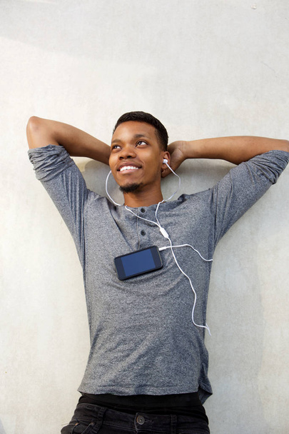 Man lying and listening to music - Photo, image