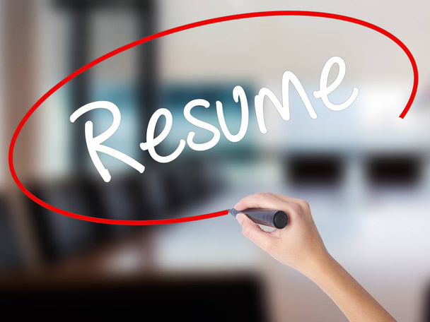 Woman Hand Writing Resume with a marker over transparent board - Photo, Image