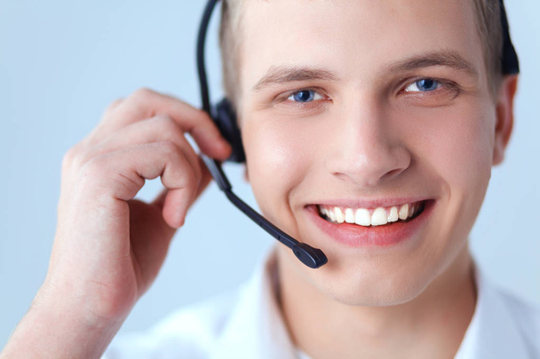 Customer support operator with a headset on white background - Foto, Bild