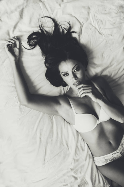 Attractive woman in the bed - Фото, изображение