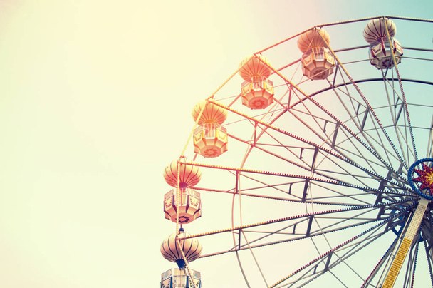 Ferris wheel on sky background with sunlight - Φωτογραφία, εικόνα
