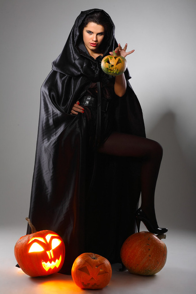 Sexual brunette in the suit of witch in night of Halloween - Foto, Imagen