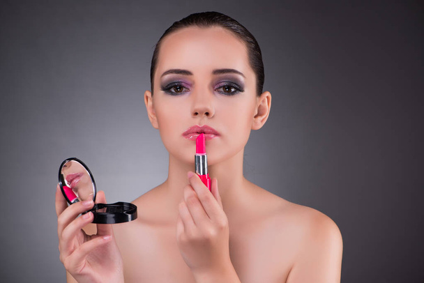 Beautiful woman in beauty concept with lipstick - Photo, Image