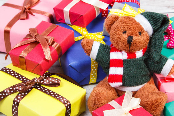 Teddy bear with colorful gifts for Christmas or other celebration - Zdjęcie, obraz