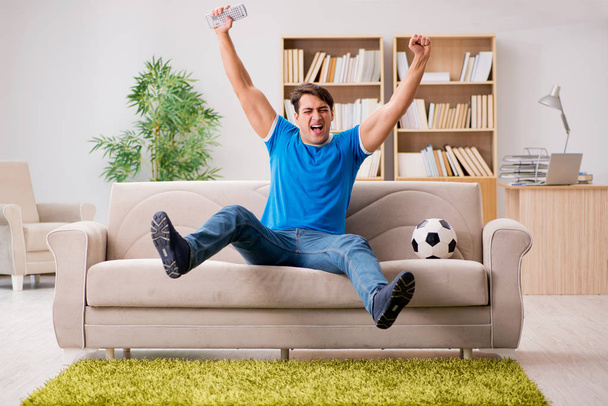 Man watching football at home - Photo, Image