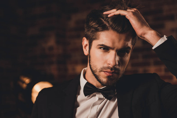 Portrait of confident sexy businessman touching his hair - Фото, изображение