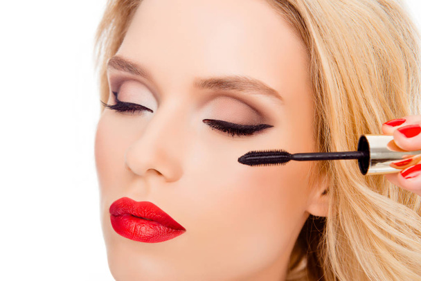 Close up of luxury woman with red lips doing make up with brush  - Zdjęcie, obraz