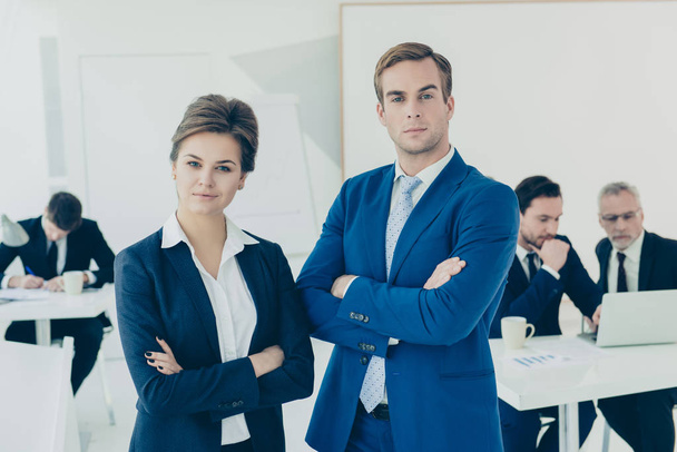 Portrait of two young confident business partners in office - Фото, зображення