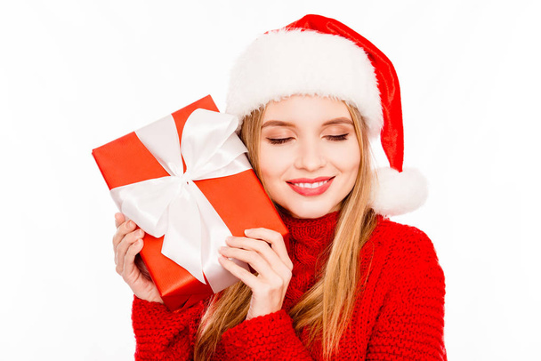 Portrait of cute happy girl holding box and dreaming about xmas  - Fotoğraf, Görsel