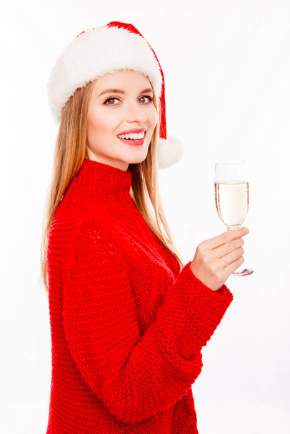 Pretty young woman in santa hat with glass of shampagne - Φωτογραφία, εικόνα