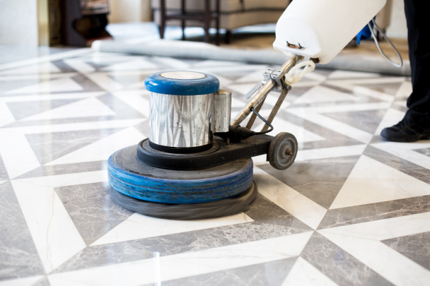 man polishing marble floor in office  - Photo, Image