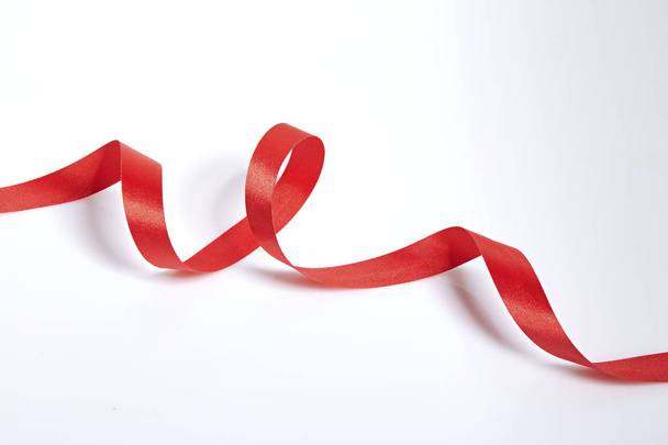 Red ribbon on a white background with clipping paths - Photo, Image
