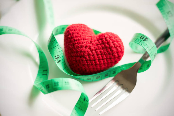 Red heart and healthy concept with measure tape - Foto, Bild