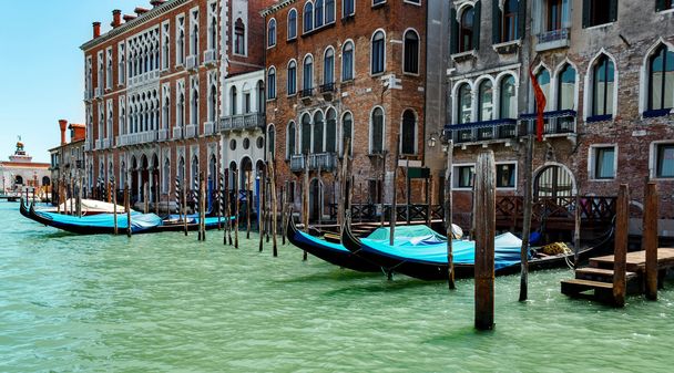 Gondolas in lagoon Venice Italy Grand canal - Фото, изображение