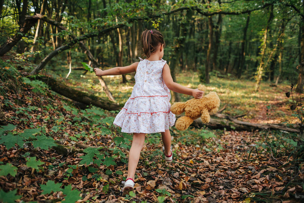 Girl walks in the woods. girl running in the woods - Photo, Image