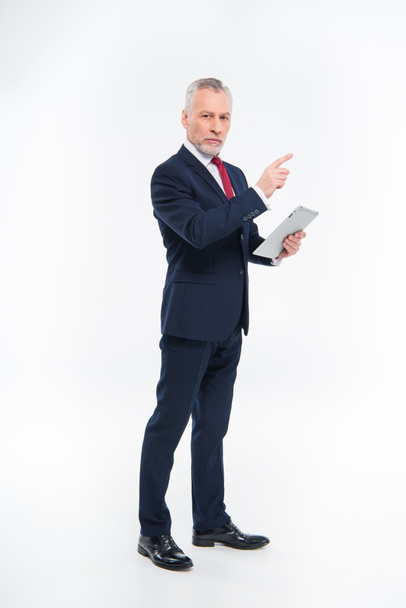 Businessman holding digital tablet - Фото, зображення