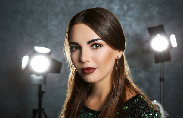 Beautiful young woman with professional facial makeup - Fotó, kép