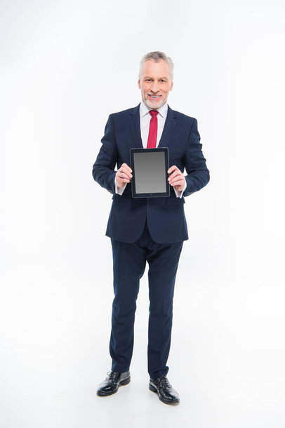 Businessman holding digital tablet - Fotoğraf, Görsel