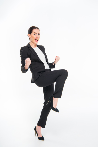 Cheerful businesswoman triumphing - Photo, Image