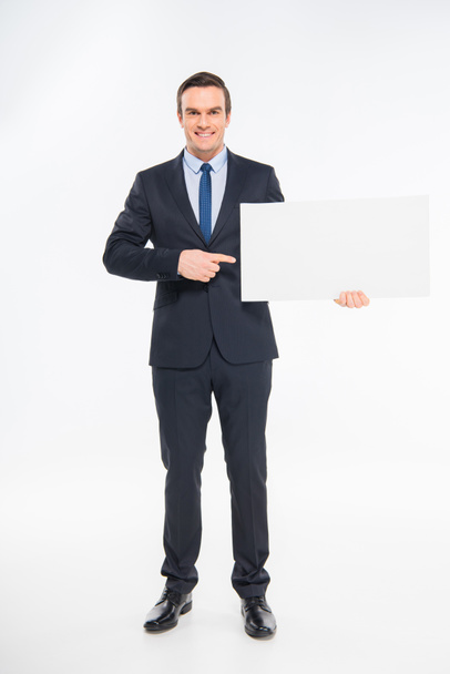 Businessman holding blank card - Фото, изображение