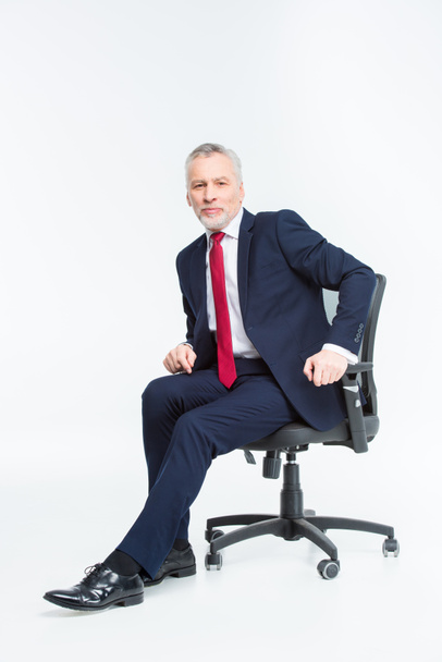 Businessman in office chair - Photo, Image