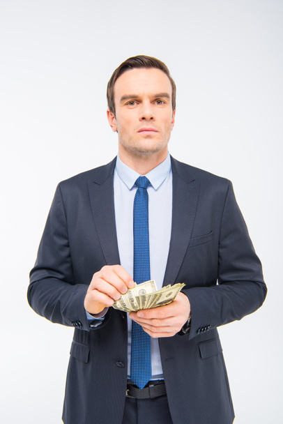 Young businessman with money  - 写真・画像