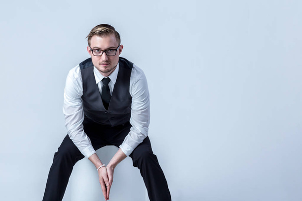 Young handsome man with great smile wearing fashion eyeglasses against neutral background with lots of copy space - Zdjęcie, obraz