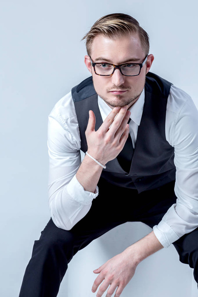 elegant business man with glasses reflects concentrated - 写真・画像