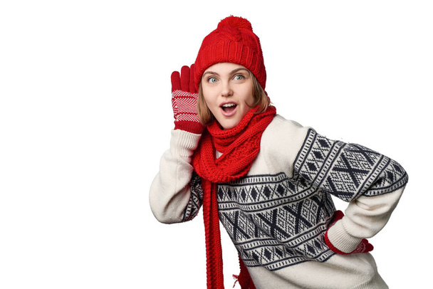 Woman in winter warm clothing listening gossip - 写真・画像