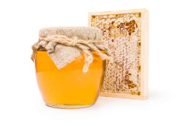Miel aislada sobre un corte de fondo blanco
 - Foto, imagen