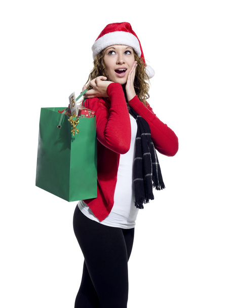 zaskoczony młoda kobieta trzymając torbę na zakupy - Zdjęcie, obraz