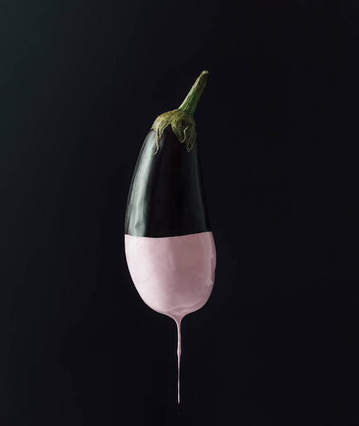 Eggplant with dripping pink paint  - Photo, Image