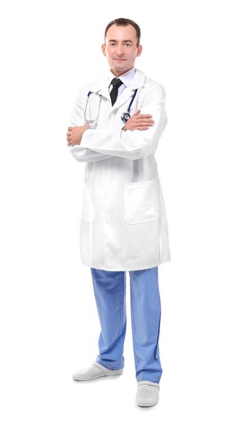 Doctor with crossed hands isolated on white - 写真・画像