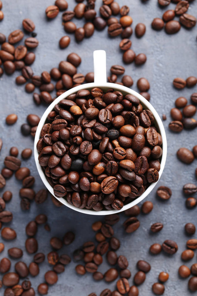 Roasted coffee beans in mug  - Фото, изображение