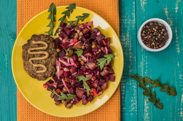 Salad Vinaigrette of beets and steak on a turquoise wooden background - Zdjęcie, obraz